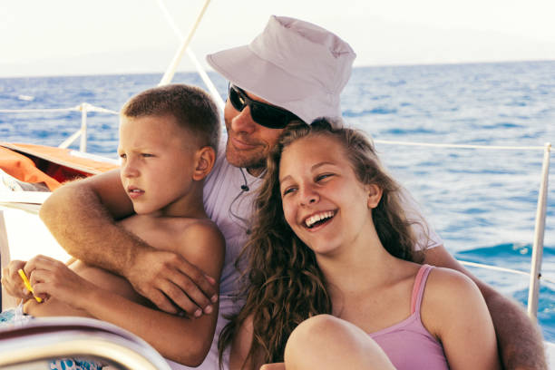 istock Father having a fun with children on sailing 961970866