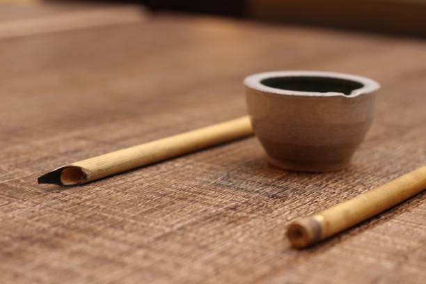 View on bamboo pen and ink bowl for writing Calligraphy Cyrillic Script