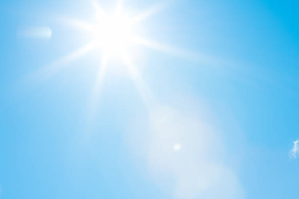 Sun in a blue sky - 50 megapixels Bright sun with beautiful beams in a blue sky. Space for copy. High resolution - 50 megapixels. sky only stock pictures, royalty-free photos & images