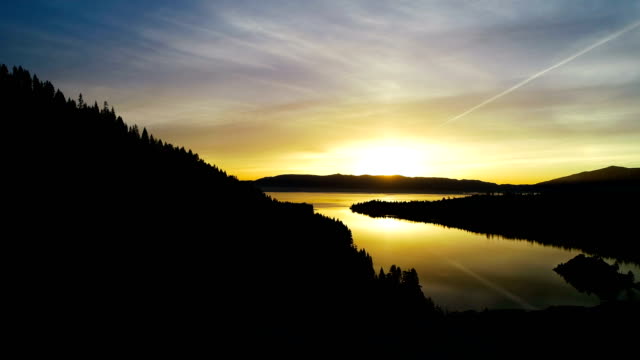 Passing close to Silhouette Tree at Sunrise in Lake Tahoe at Emerald Bay