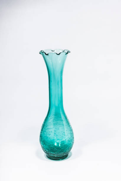 Green glass carafe on the white background