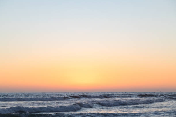 Beautiful sunset with sun over the horizon.