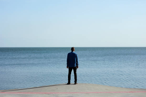 istock Young man looking at the Ocean 961982342