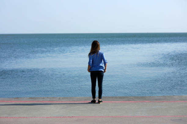 istock Young woman looking at the Ocean 961982516