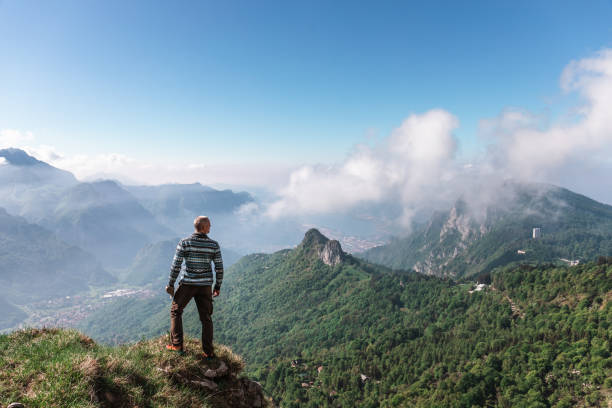 istock Man looking away on the top mountain 961990300