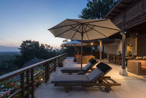 istock Illuminated luxurious villa with armchairs at sunrise in Bali 961998958