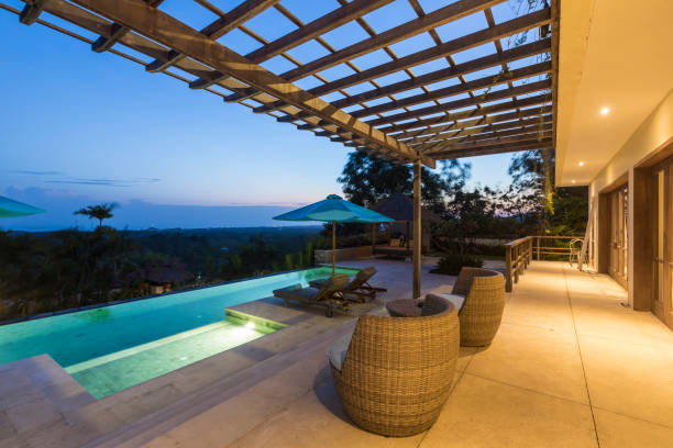 istock Illuminated luxurious villa with swimming pool at sunrise in Bali 961998994