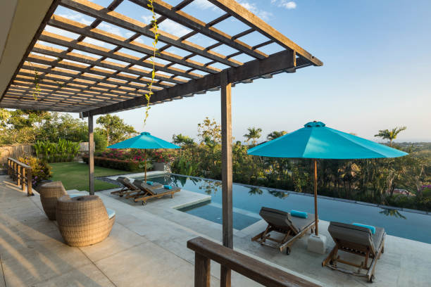 istock Luxurious villa with swimming pool and armchairs in Bali 962000264
