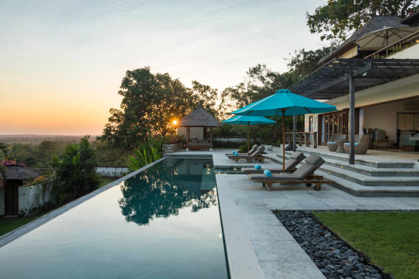 istock Luxurious villa with swimming pool at sunrise in Bali 962000456