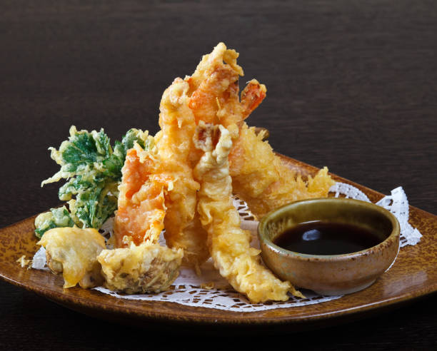 istock Tempura shrimps (deep fried shrimps) with soy sauce. 962003406