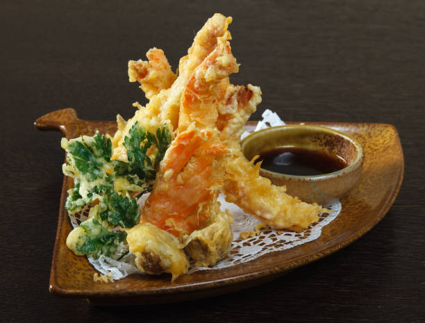 istock Tempura shrimps (deep fried shrimps) with soy sauce. 962003412