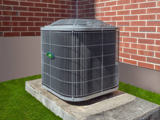 Air conditioning unit outside an apartment complex High efficiency modern AC-heater unit, energy save solution-horizontal, outside an apartment complex compressor photos stock pictures, royalty-free photos & images