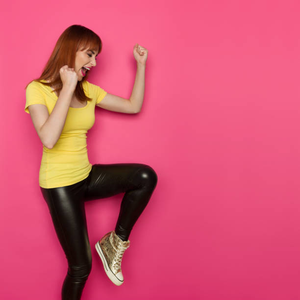 istock Excited Woman Is Standing On One Leg, Gesturing And Shouting 962008378