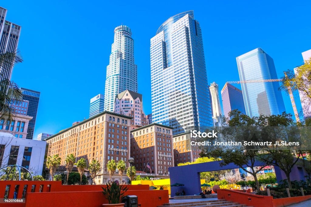 Pershing Square Downtown Los Angeles Pershing Square in Downtown Los Angeles. The Millenium Biltmore hotel is in the foreground (Brick buildings), US Bank tower in the back left. City Of Los Angeles Stock Photo