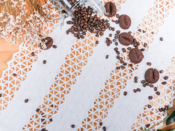 istock coffee bean and coffee cookies set on vintage lace tablecloth background. 962010918