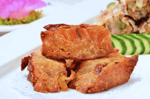 Close up of deep fried bean curd skin stuffed with kumquat