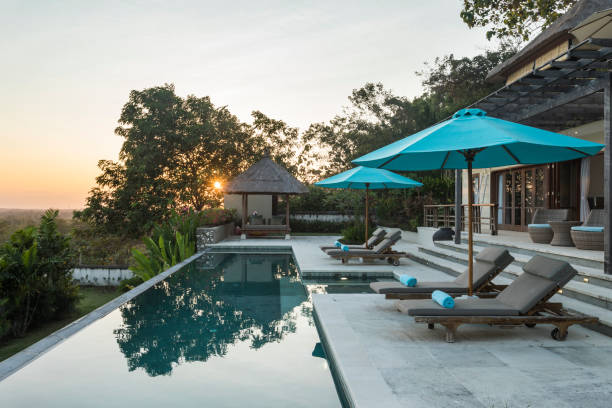 Sunrise in a luxurious villa with swimming pool in Bali stock photo