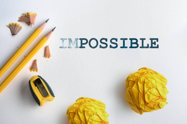 istock Erasing text IMPOSSIBLE to POSSIBLE on a white drawing watercolor paper , motivate to possible things  concept 962024628
