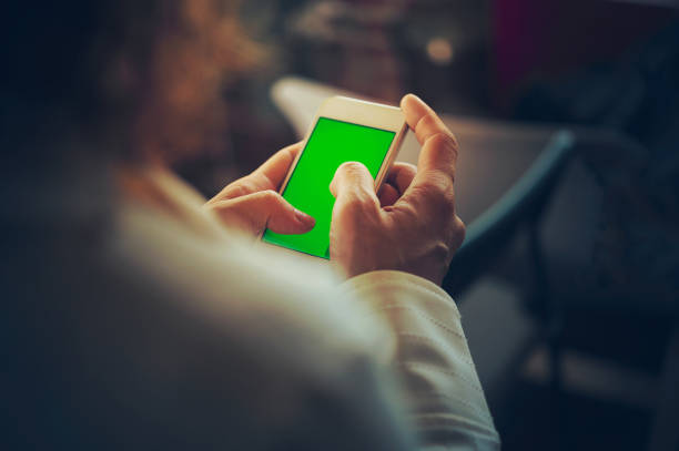 business  Woman with mobile phone, green screen