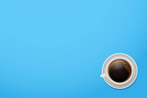 istock Top view of a coffee mug. Vector cup of coffee on a vivid blue desktop background with copyspace. 962035650