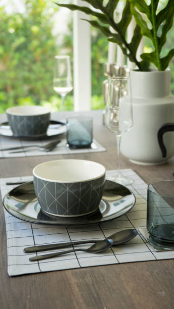 istock plate setting on wooden dining table at home 962035654