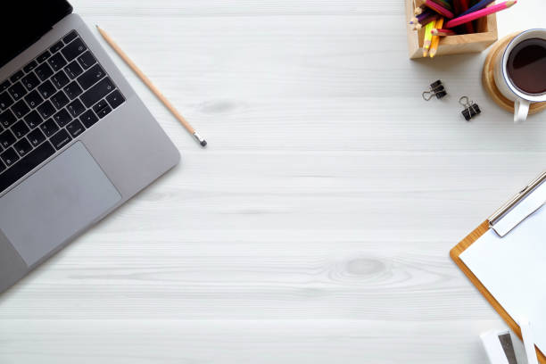 istock Office wooden desk laptop computer, office accessory and copy space. 962036142