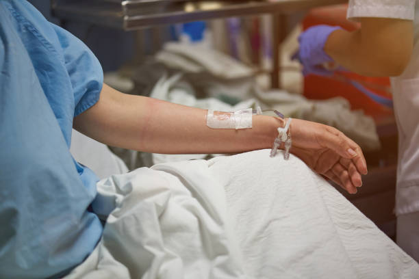 istock Nurse set catheter in patient hand 962036688