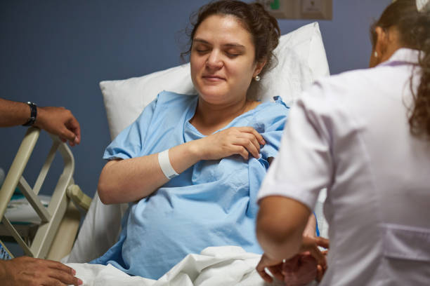 istock Nurse checking young woman helth 962036706
