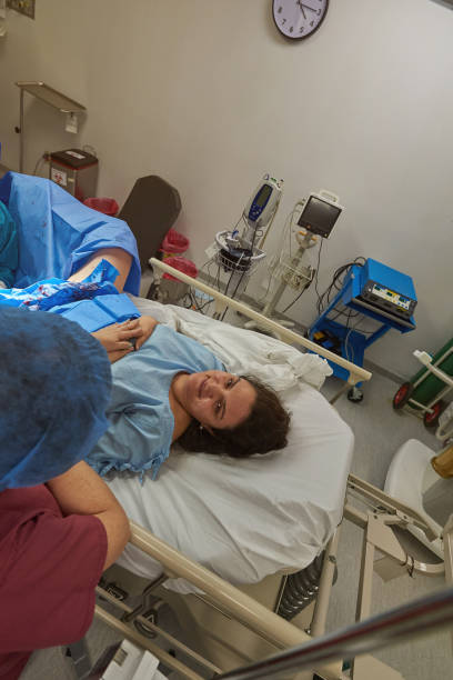 istock Happy woman in surgery bed 962036850