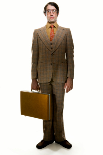 Parody of retro businessman with briefcase.