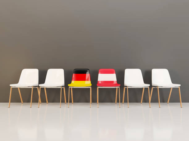 istock Chairs with flag of Germany and austria in a row 962041228