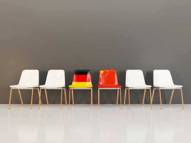 istock Chairs with flag of Germany and china in a row 962041330