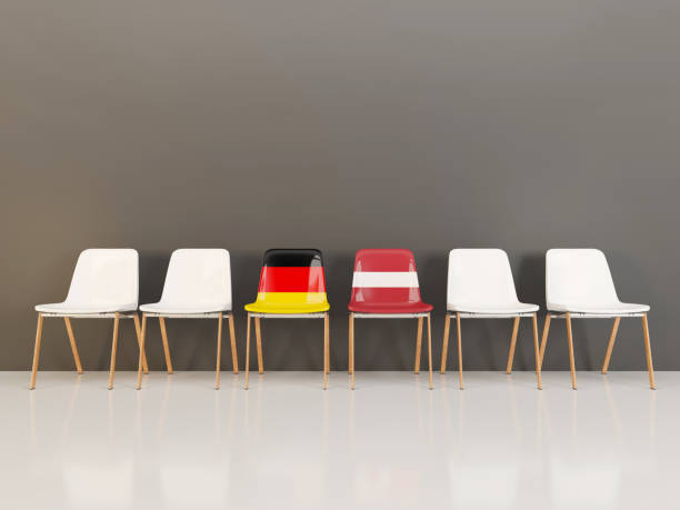 istock Chairs with flag of Germany and latvia in a row 962042032