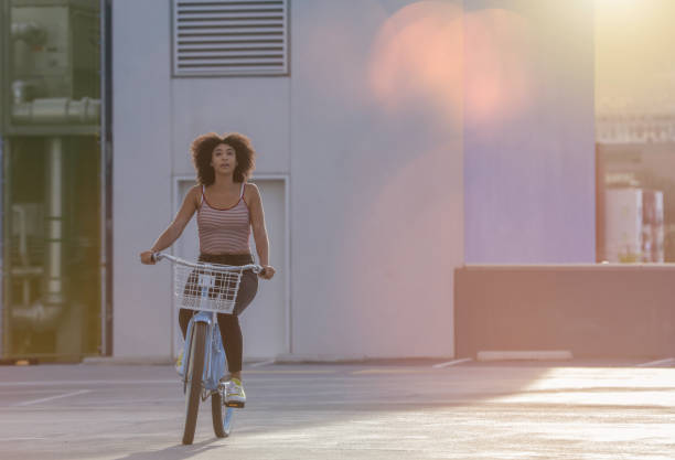 istock Woman riding a bike 962042346