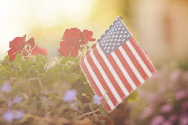 istock Memorial Day background with American flag in sunshine 962046924