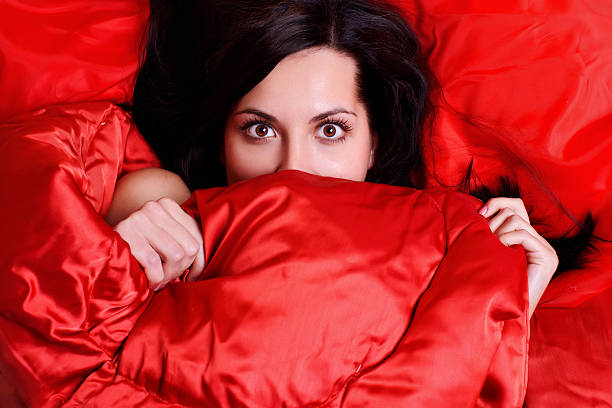 istock surprised woman covered her face with a sheet 96204946