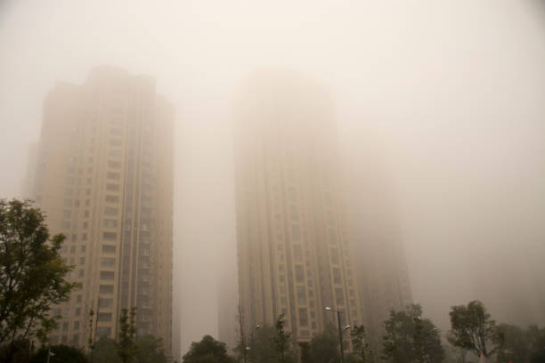Tall residential buildings in the form of a tower, immersed in a misty sky. Cyberpunk stylistics. Dramatic, depressing mood.