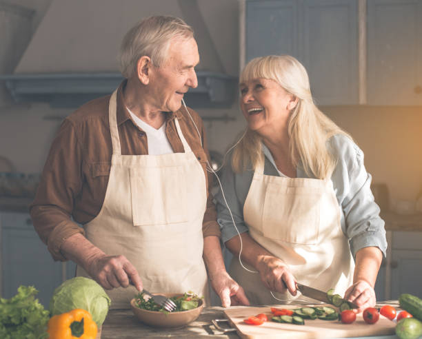 istock Joyful elderly husband and wife cooking with enjoyment 962066584