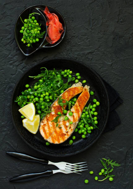 istock baked fish or roasted fillet or steak with peas, 962067686