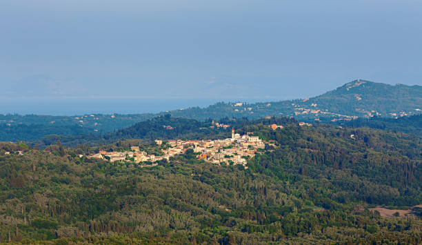 istock Landscape with a distant greek village 962070258