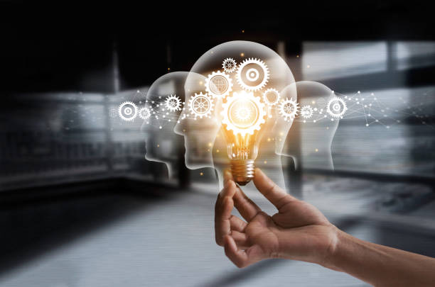istock Hand holding light bulb and cog inside. Idea and imagination. Creative and inspiration. Innovation gears icon with network connection on human heads on metal texture background. Innovative technology in science and industrial concept 962071696