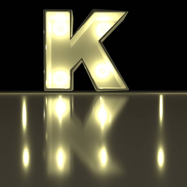 istock Character K font with reflection. Light bulb glowing letter alphabet. Capital symbol on black background. 3d rendering 962072550