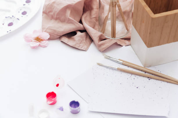 istock Art Workspace with watercolor paint, coffee cup for artists. Top view, copy space 962077062