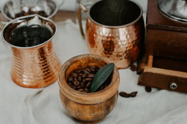istock Turkish coffee in traditional embossed metal pot and coffee beens 962077484