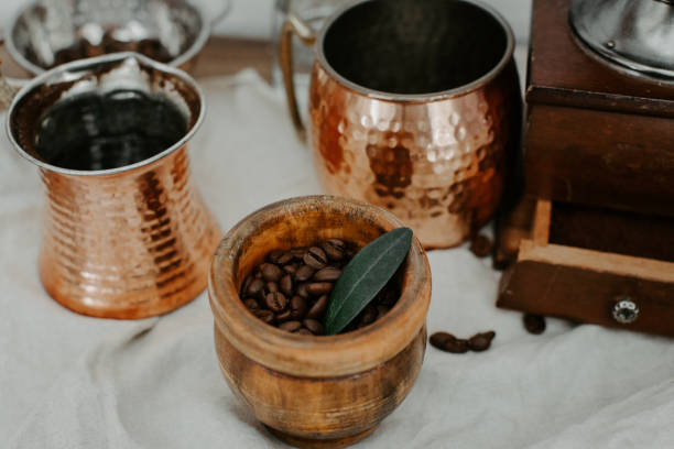 turkish coffee in traditional embossed metal pot and coffee beens - koffie imagens e fotografias de stock