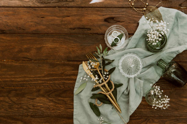 istock Flat lay wedding concept. Decorations and tableware over wooden background 962077870