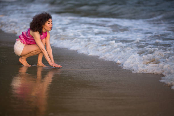 istock Young mixed race woman on a tropical beach. 962080838