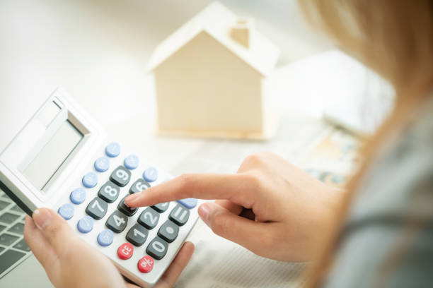 istock Woman accountant or bank worker uses calculator. 962081102