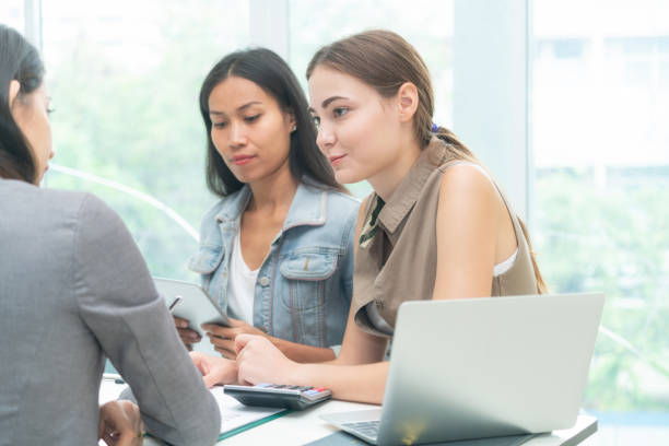 istock Multicultural businesswomen in group meeting. 962081128