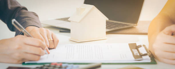 istock Client Signs Document to Buy House and Real Estate 962081136